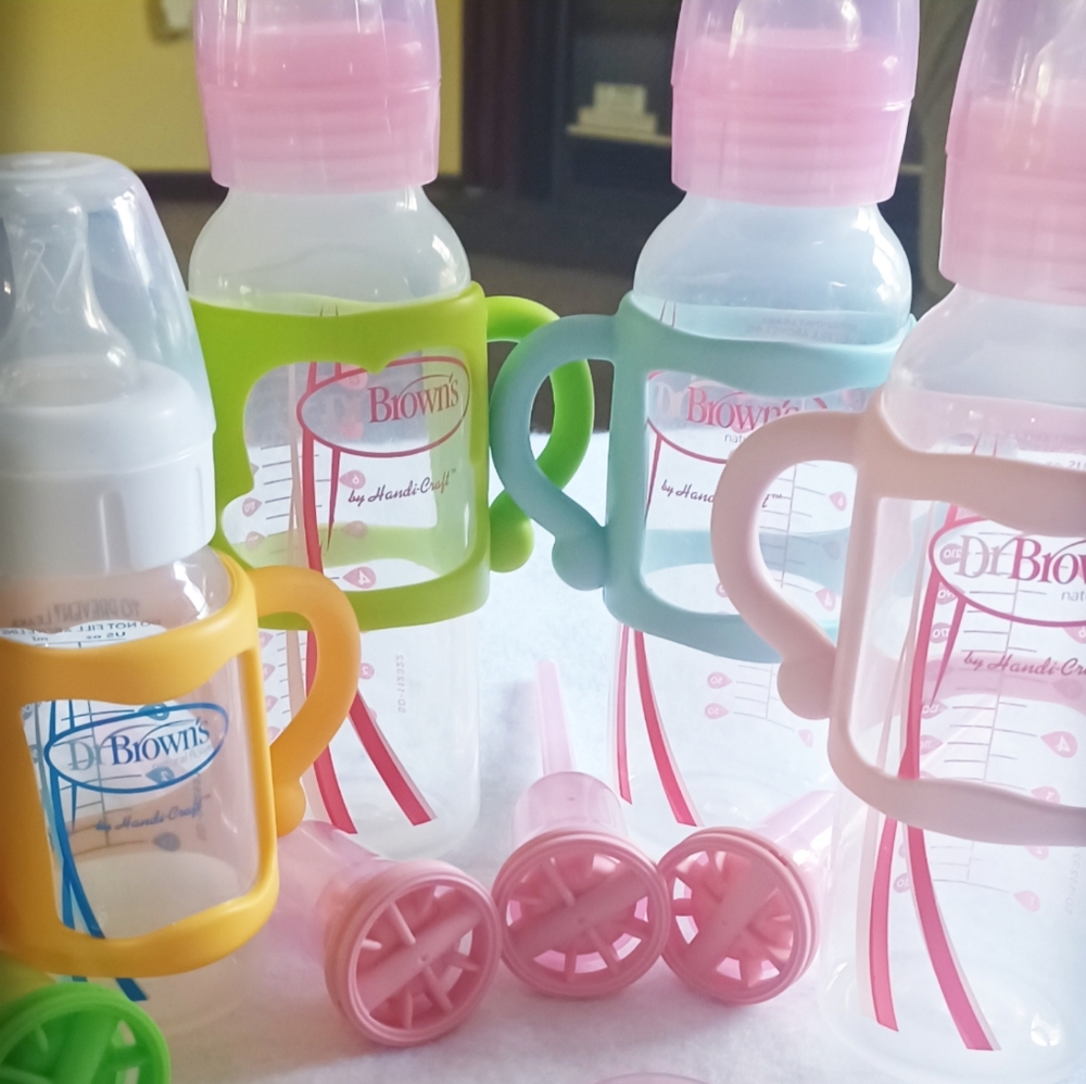 Dr. Brown's baby bottles with pack of brand new nipples and accessories